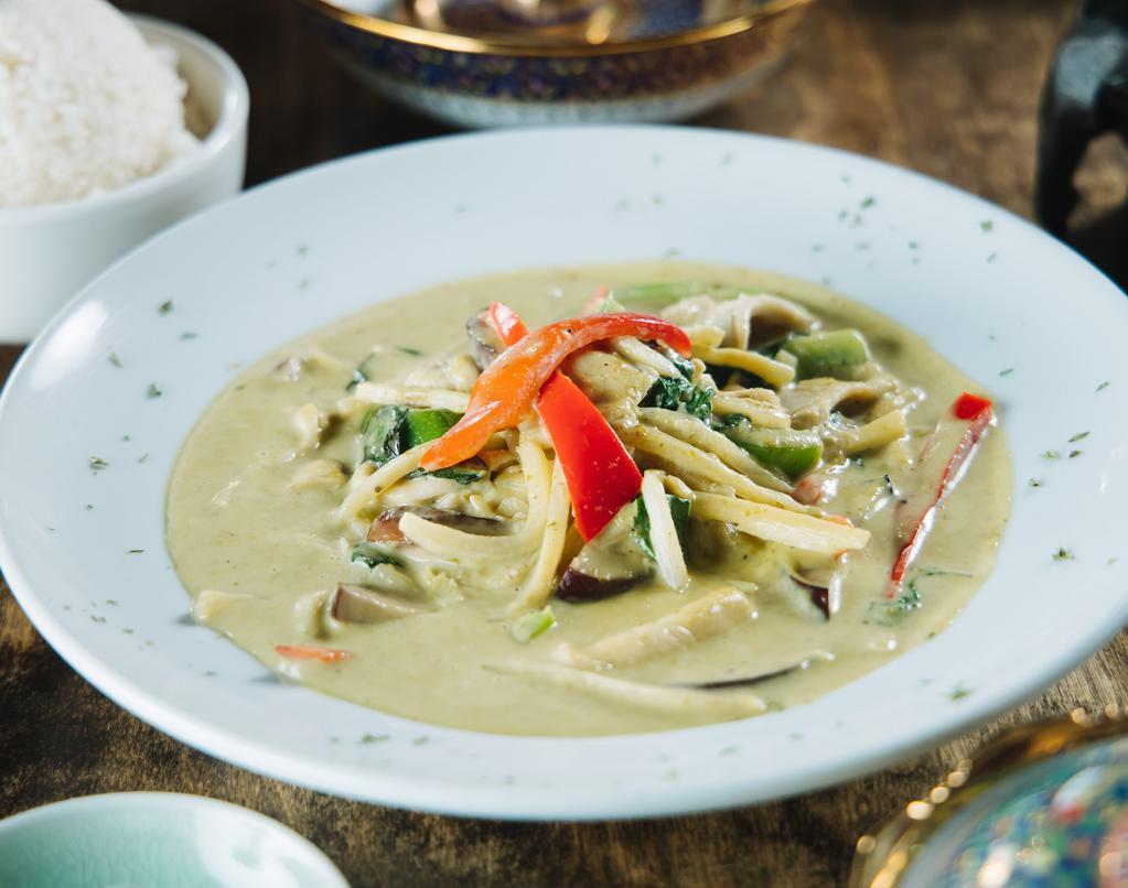 Green Curry · Choice of chicken, beef, or pork with bell peppers, coconut milk, bamboo shoots, eggplant, & basil. Served with steamed rice.