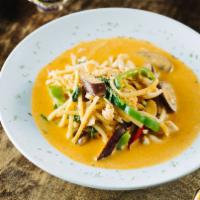 Red Curry · Choice of chicken, beef, or pork with bell peppers, coconut milk, bamboo shoots, eggplant, &...