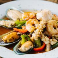 Basil Seafood · Shrimp, calamari, mussels, and scallops wok-tossed with basil, chilies, and bell peppers. Se...