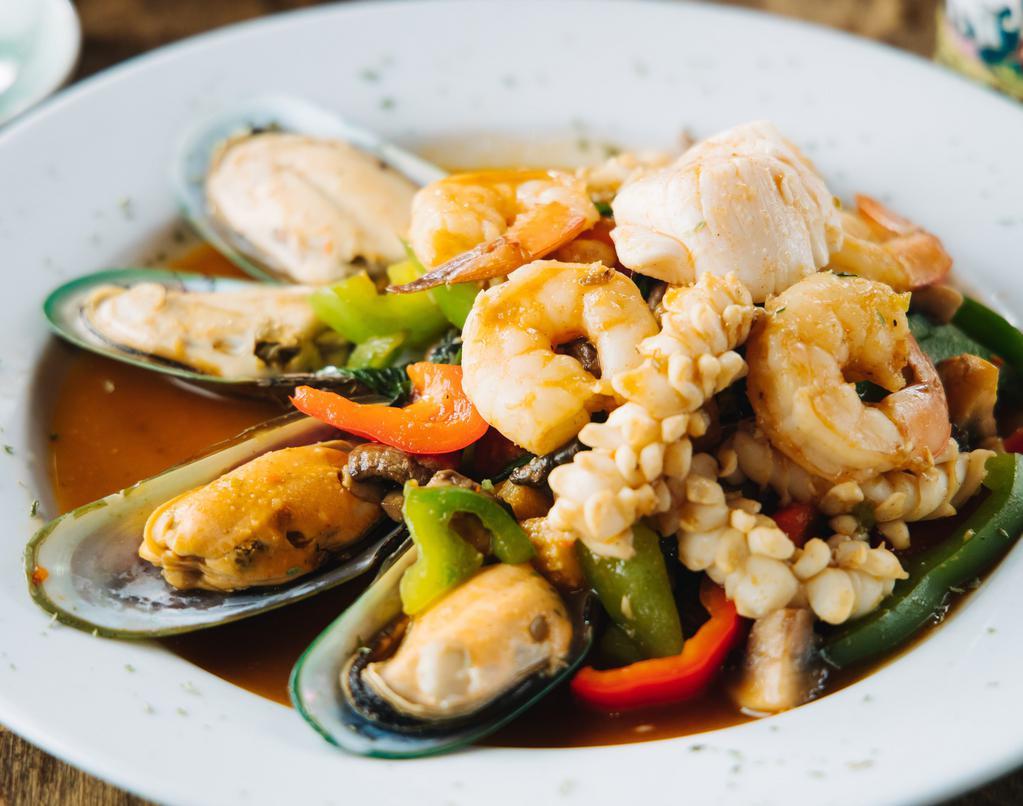 Basil Seafood · Shrimp, calamari, mussels, and scallops wok-tossed with basil, chilies, and bell peppers. Served with steamed rice.