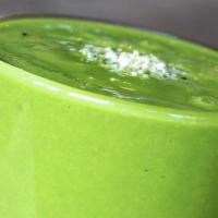 Green Retreat · Frozen pineapples, mangos, spinach, kale, avocado, lemon juice, and coconut water. Garnished...