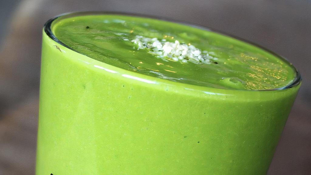 Green Retreat · Frozen pineapples, mangos, spinach, kale, avocado, lemon juice, and coconut water. Garnished with hemp seeds.