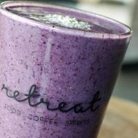 Blueberry Bliss · Frozen blueberries, almond butter, honey, and almond milk. Garnished with hemp seeds.