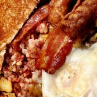 Superman · 2 eggs, 2 pieces bacon, 2 pieces sausage, bit of home fries, bit of hash, toast and 2 pancak...