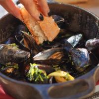 White Wine & Garlic Mussels · A generous portion of fresh mussels cooked in a white wine & garlic broth. Served with a scr...