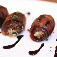 Blue Cheese Bacon Dates · Four bacon-wrapped dates stuffed with blue cheese. Roasted and finished with a sweet balsami...