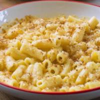 Seven Cheese Macaroni · Handmade pasta tossed in a rich and creamy blend of seven cheeses, topped with toasted bread...