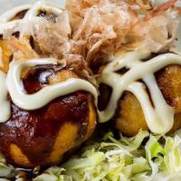 Takoyaki (3 Pieces) · 3 golden battered octopus bites brushed with takoyaki sauce, seasoned mayo and bonito flakes.