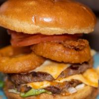 American Burger  · Lettuce, tomato, Onion rings, caramelized onion, gherkin, cheese, mayonnaise, and american M...