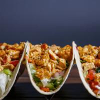 Chicken Tacos · Marinated chicken in Portuguese Peri Peri sauce then flame grilled to order in your chosen s...