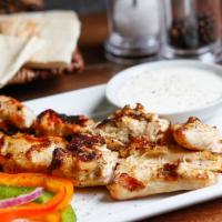 Espetada · Cubes of chicken skewered, flamed grilled and basted in your choice of peri peri sauce.
