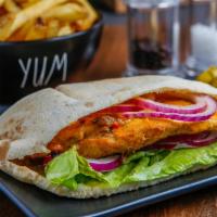 Chicken Pita · Marinated chicken breast in Portuguese Peri Peri sauce then flame grilled to order in your c...