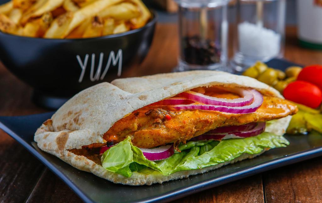 Chicken Pita · Marinated chicken breast in Portuguese Peri Peri sauce then flame grilled to order in your chosen spice. Topped with lettuce, mayonnaise, and red onions. Serve in a pocket pita.
