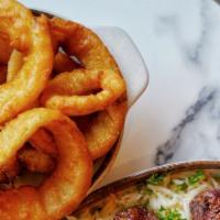Onion Rings · Onions lightly dipped in our homemade batter and fried to perfection.