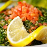 Tabouleh · Chopped parsley, wheat grains, tomatoes, onions, lemon juice, and olive oil.