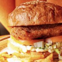 Crispy Chicken Sandwich · Hand breaded fried chicken breast served on a bun topped with lettuce, tomatoes and pickles.