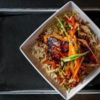 Lacquered Salmon Stir Fry · Glazed Salmon Filet with Warm Ginger-Soy Dressing served over Basmati Rice