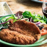 Milanesa Buenos Aires · Hand-breaded chicken breast served with rice.
