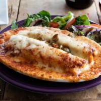 Latin Crepe · Chicken ricotta wrapped in a crepe and topped with béchamel and tomato sauce, cheese, olives...