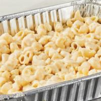 Halft Tray White Cheddar Mac And Cheese · Serves 6-8. Our wonderfully creamy white cheddar mac and cheese is a delightful classic for ...
