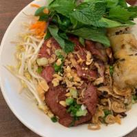 Vermicelli Rice Noodle With Grilled Pork Sausage And Egg Roll · Our Bun Nem Nuong Cha Gio consists of rice noodles, grilled pork sausage and egg rolls, topp...