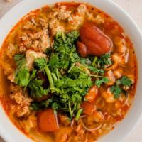 Conch & Crabmeat Noodle Soup (Bun Rieu Oc) · Vietnamese rice noodle soup with tomato and crab soup base. It is served with crab meat, con...