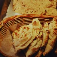 Naan · Leavened fine flour bread baked in the tandoor.