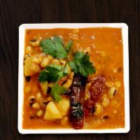 Chana Masala · Chickpeas cooked with potatoes in a spiced sauce.