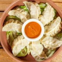 Nepali Momo (Regular) · Eight pieces. Momo is a type of steamed dumpling with ground veg or chicken or lamb. Momo ha...