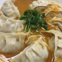Nepali Momo (Jhol Momo) · Eight pieces. Momo is a type of steamed dumpling with ground veg or chicken or lamb. Momo ha...