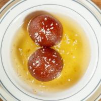 Gulab Jamun · Homemade deep fried cottage cheese balls dipped in a honey and rose water syrup topped with ...