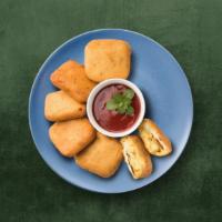 Crisp Cottage Cheese Fritters · Cottage Cheese cubes dipped in spicy batter and fried golden and crispy.