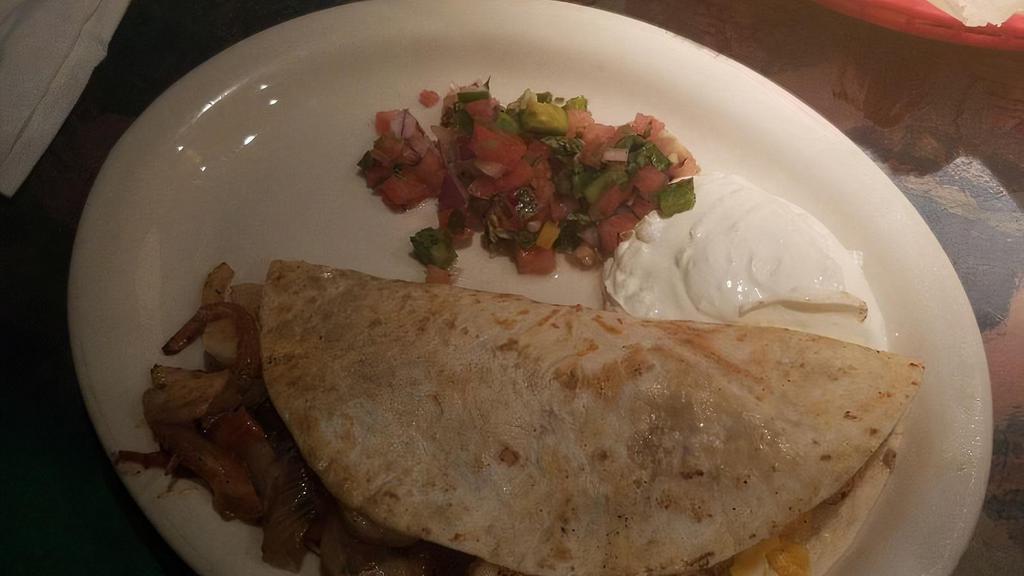 Shrimp Quesadilla · Stuffed with shrimp, cheese, and vegetables. Served with pico de gallo and sour cream.