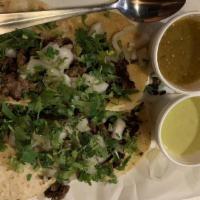 Mexico’S Tacos · Four steak, chicken, or carnitas tacos served in a small double corn tortilla with onions, a...