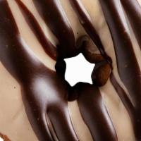 Peanut Butter In Paradise · Peanut butter icing with chocolate drizzle