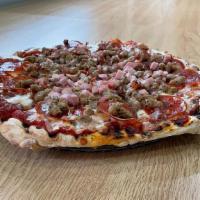 The Slaughterhouse Pizza · Hand tossed dough with a homemade pizza sauce, our signature cheese blend with sausage, pepp...