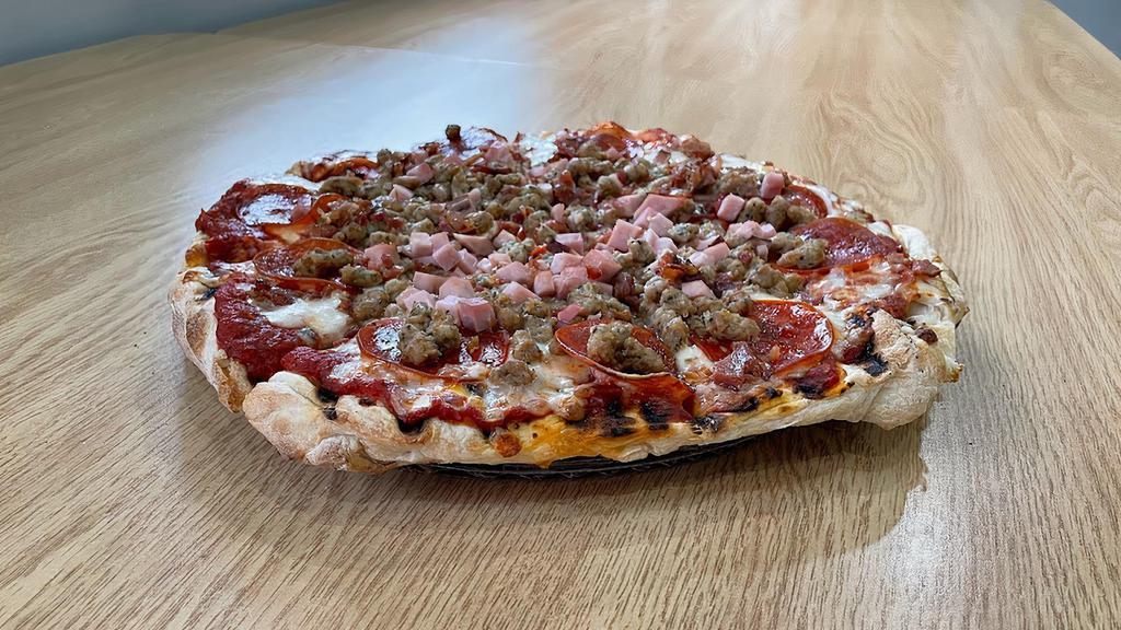The Slaughterhouse Pizza · Hand tossed dough with a homemade pizza sauce, our signature cheese blend with sausage, pepperoni, ham and bacon.