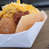 Coney Dog · Premium hot dog smothered with delicious Coney sauce. Top with diced onions and cheese for n...