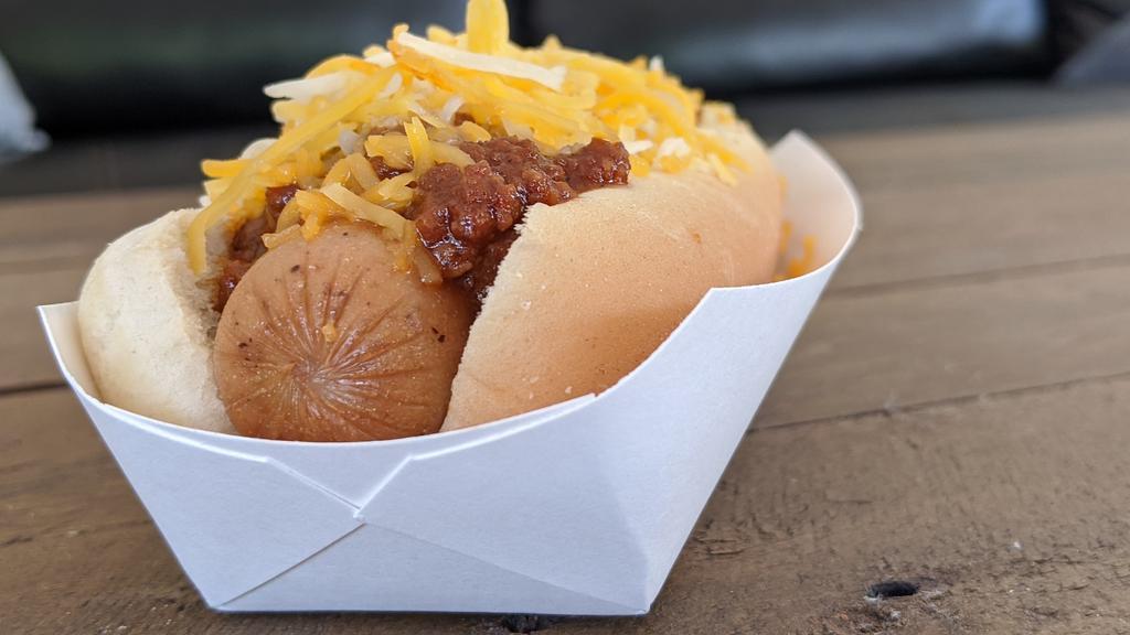 Coney Dog · Premium hot dog smothered with delicious Coney sauce. Top with diced onions and cheese for no extra charge.
