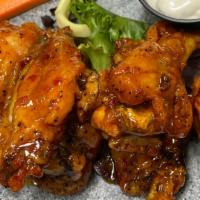 Salsa Con Fuego Chicken Wings · Choose from Caribbean Guava, Buffalo, or Sweet Chili.