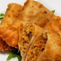 Empanada · An empanada filled with Beef, Chicken, or Cheese.