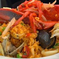 Seafood Paella · 4oz Lobster Tail, Shrimp, Clams, Mussels, Calamari and Saffron Rice.