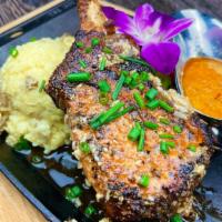 Pork Chop · (Chuleta) Grilled Spice Rubbed Pork Chops served with Mashed Potatoes and Sauteed Vegetables...