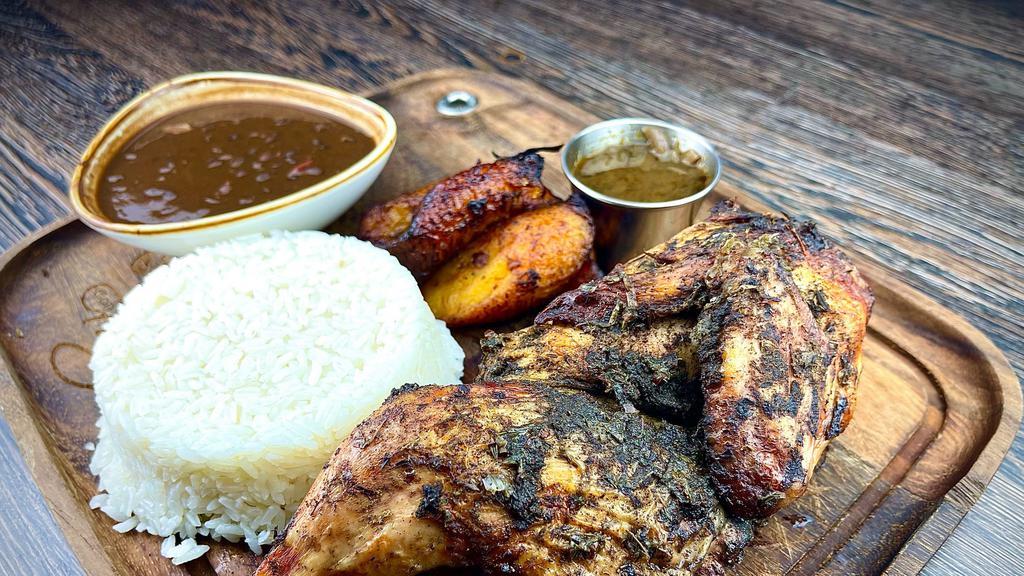 Jerk Chicken · Roast Jerk Chicken served with White Rice, Red Beans and Maduros