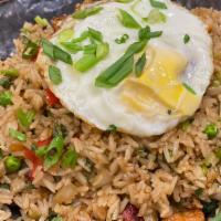 Fried Rice · with shrimp, chicken and pork, sweet plantain topped with a fried egg