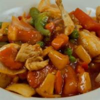 53 Sweet And Sour  · Cucumber, onions, tomatoes, pineapples, bell. peppers, peas, baby corn, and carrots in sweet...