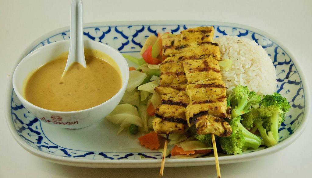 90 Khao Pha Ram · Grilled chicken skewers, steamed mixed vegetables served with peanut sauce and jasmine rice.