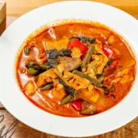Red Curry · Little spicy. Red curry paste, bamboo shoots, bell peppers, chili peppers, Thai eggplant, gr...