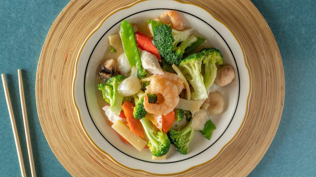 House Special Seafood · With white rice . Jumbo shrimp, scallops, and crab meat, with mixed vegetables in a light delicious white sauce.