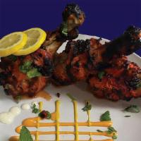 Chicken Wings (6 Piece) · Crispy Chicken Wings Marinated in Indian Spices & Grilled in Clay Oven Tandoor.